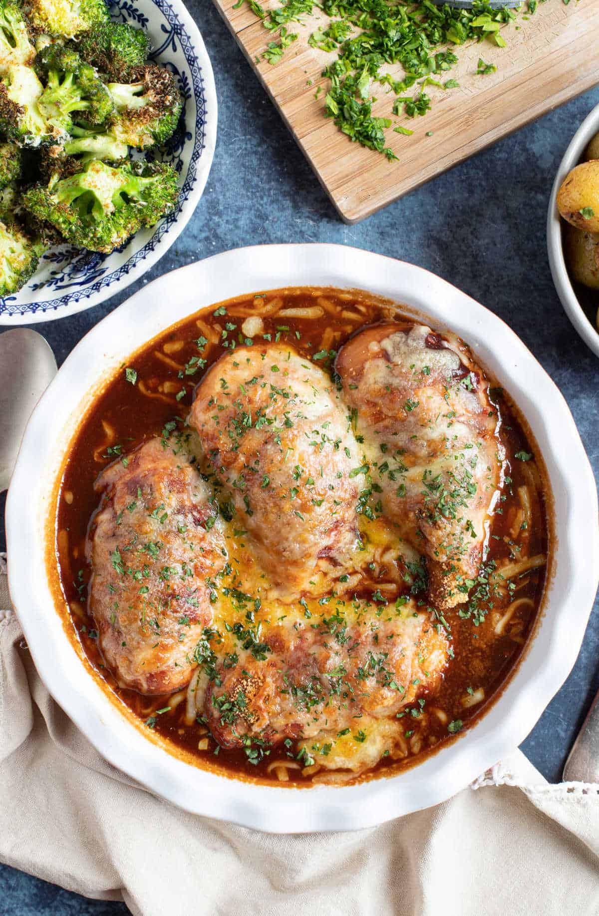 Slow cooker hunters chicken in a serving dish.