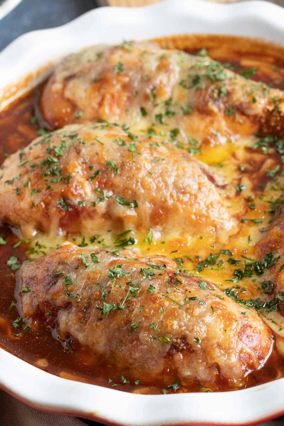 Slow cooker hunters chicken in a serving dish.