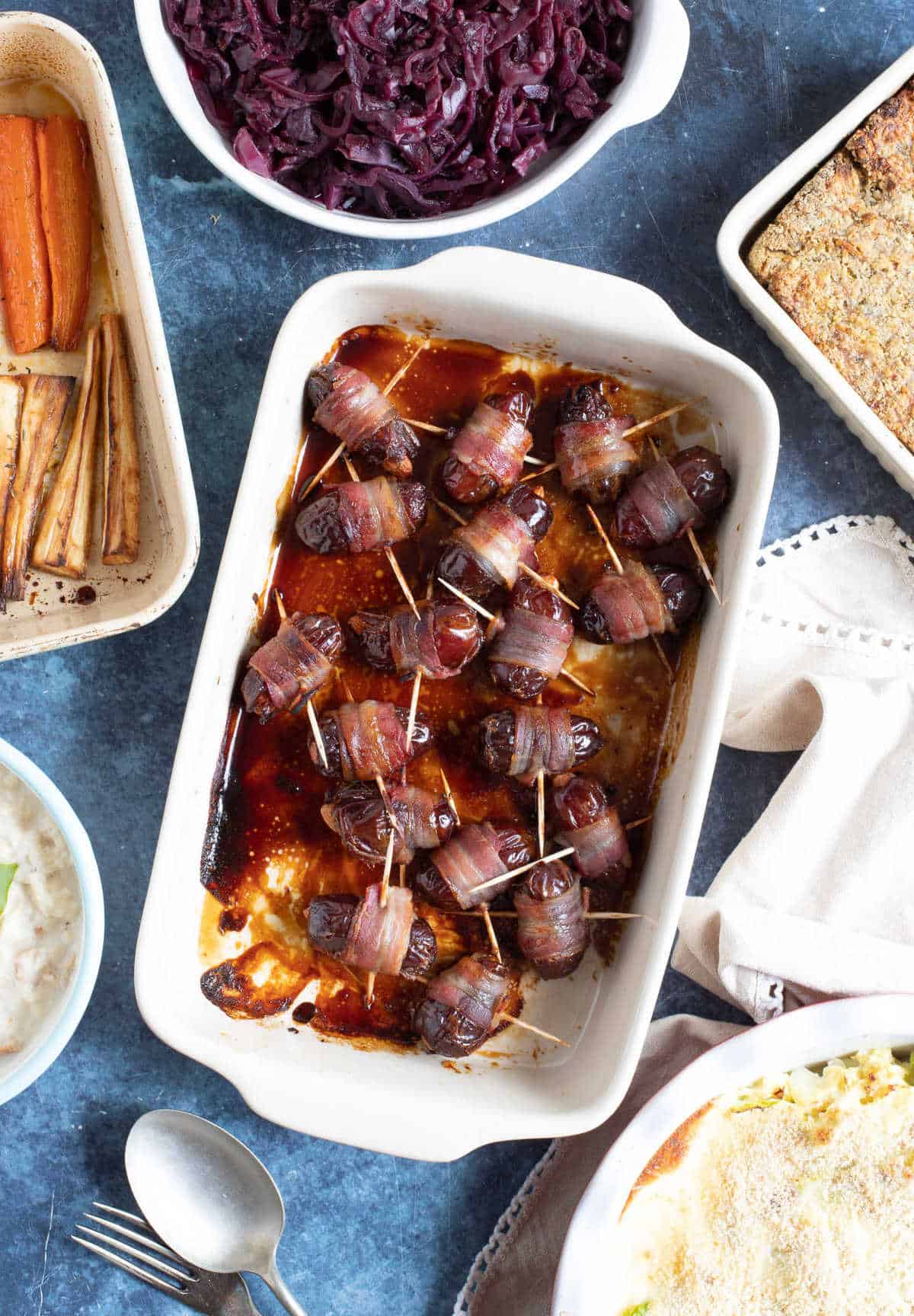 Devils on horseback in a baking dish.