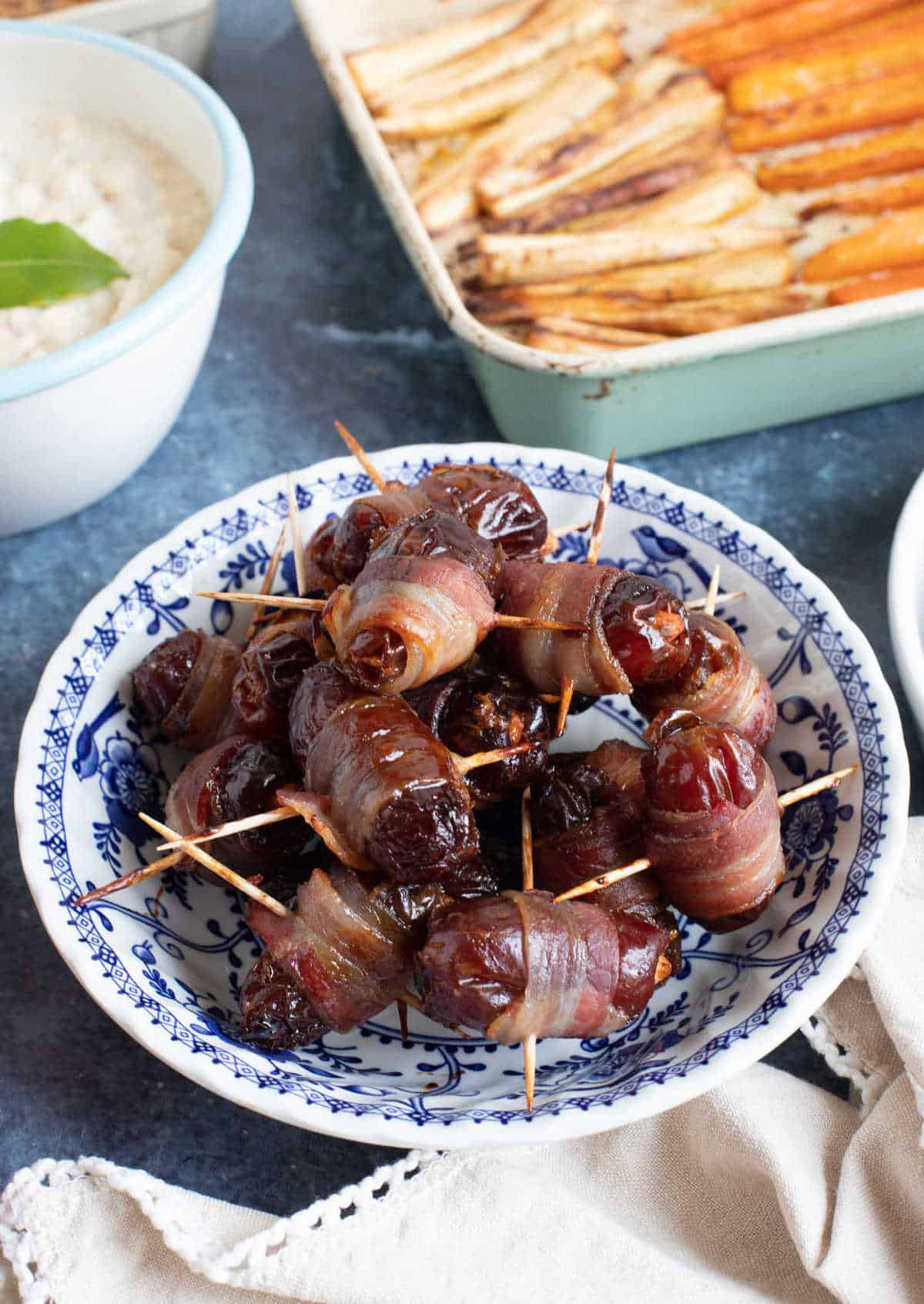 Easy devils on horseback in a serving bowl.