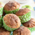 Easy cinnamon apple muffins on a cake stand.