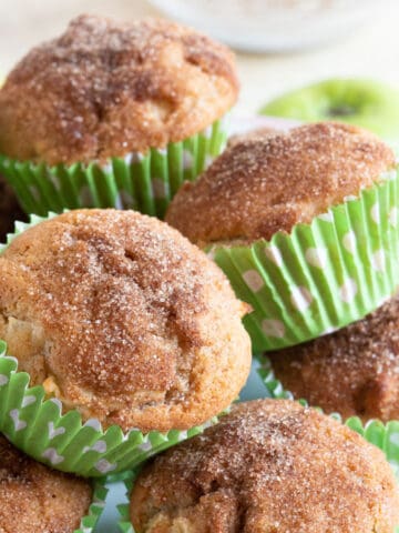 Easy cinnamon apple muffins on a cake stand.