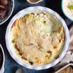 Creamed cabbage in white serving dish.