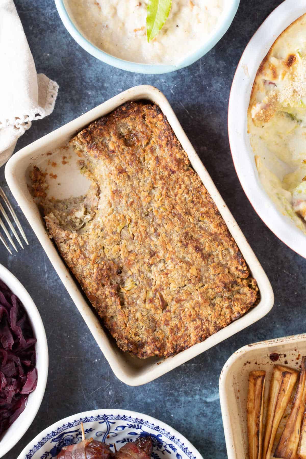 Sausage meat stuffing served alongside parsnips and red cabbage.