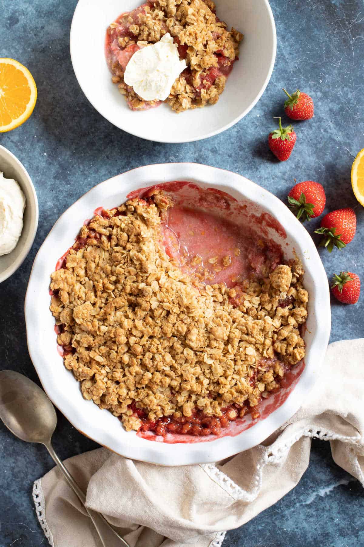 Strawberry crumble served with whipped cream.