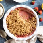 Strawberry crumble in a pie dish.