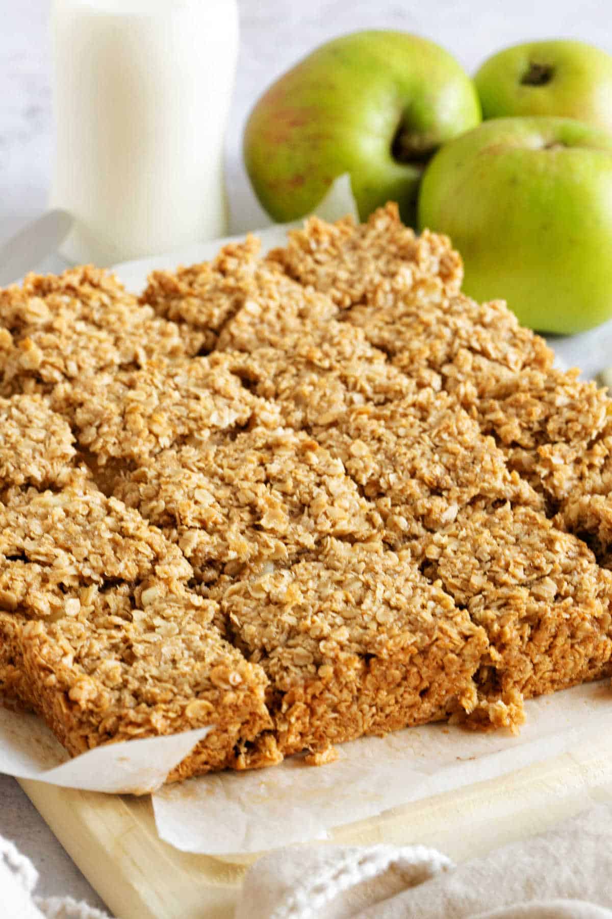 Apple flapjacks on a wooden board.