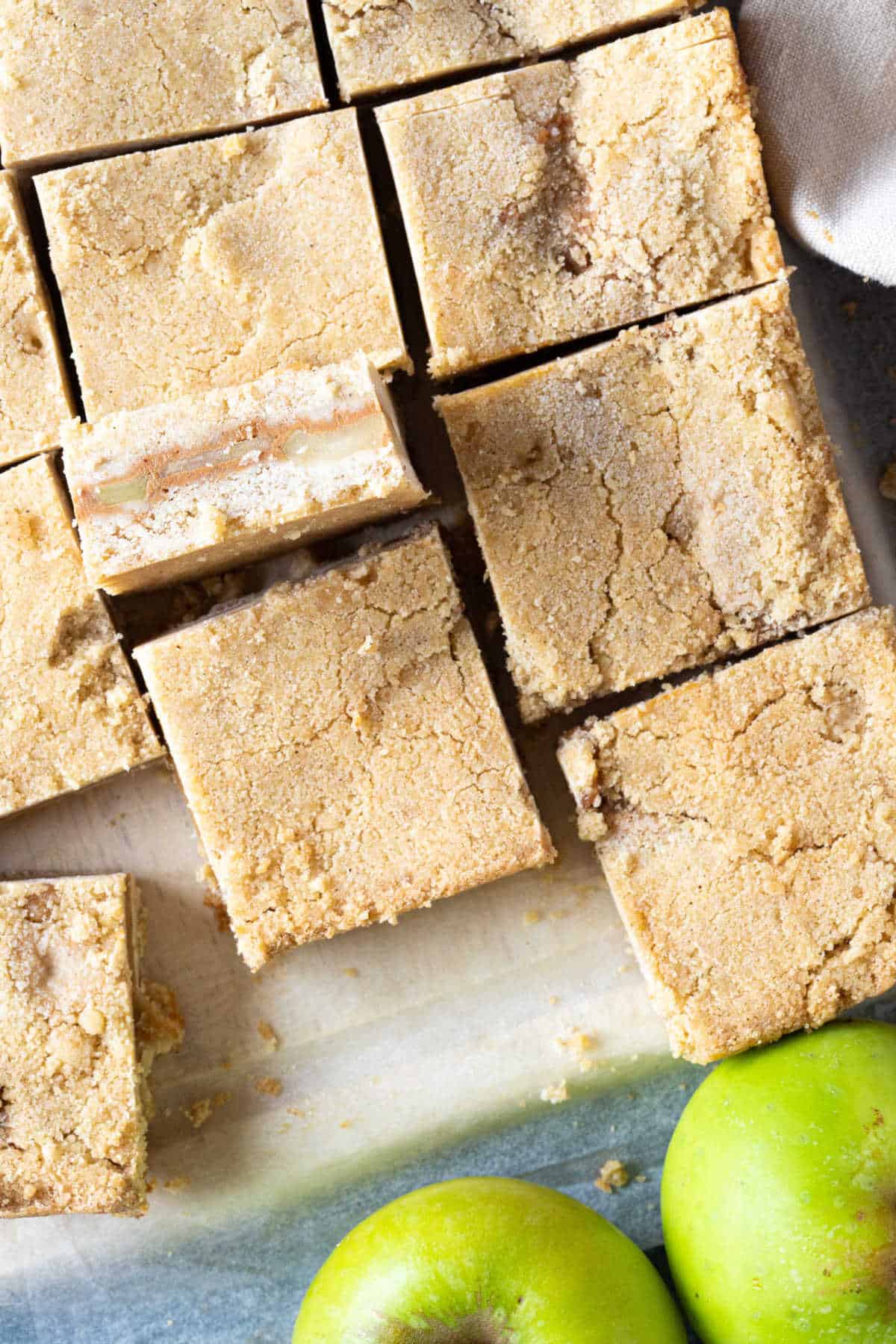 Caramel apple pie bars on a wooden board.