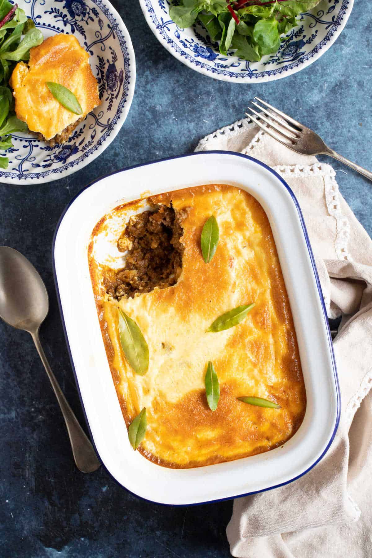 Bobotie in an enamel serving dish.