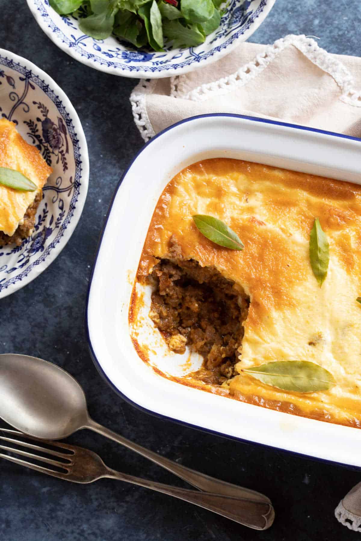 Traditional bobotie served in a white dish.