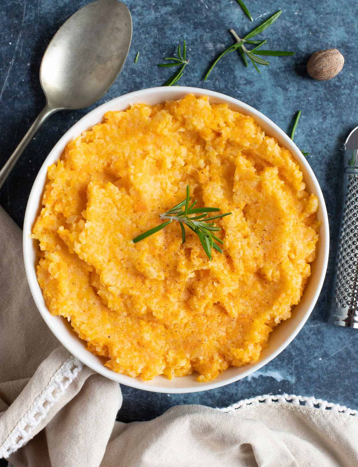 Carrot and rutabaga mash in a bowl.