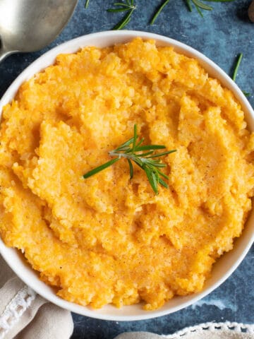 A bowl of carrot and swede mash.