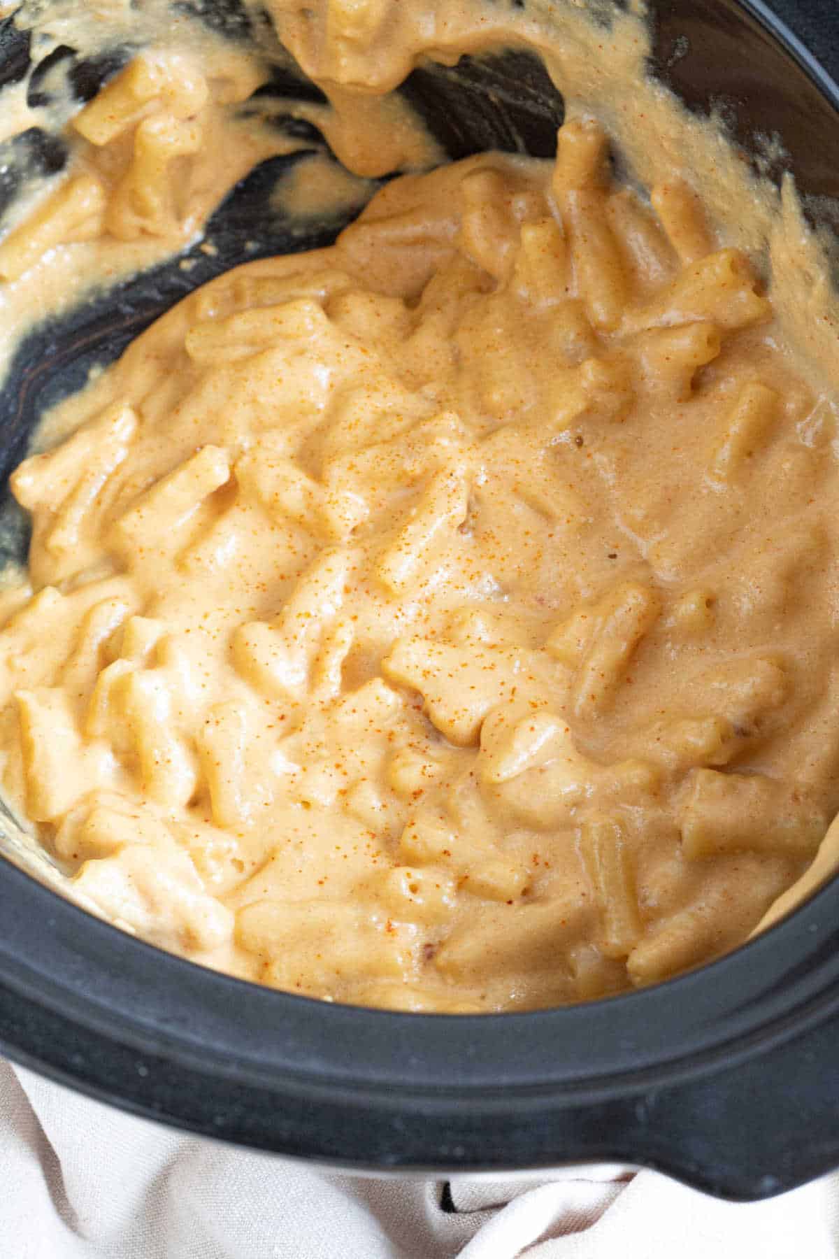 Slow cooker mac and cheese in a crockpot basin.