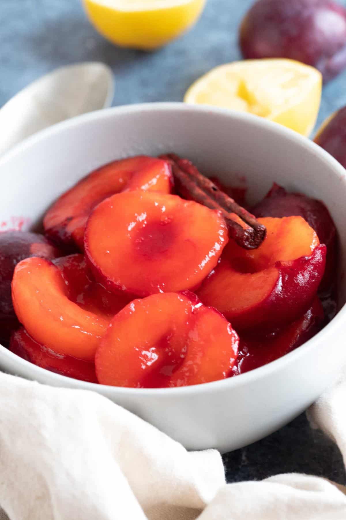 Poached plums in a bowl.