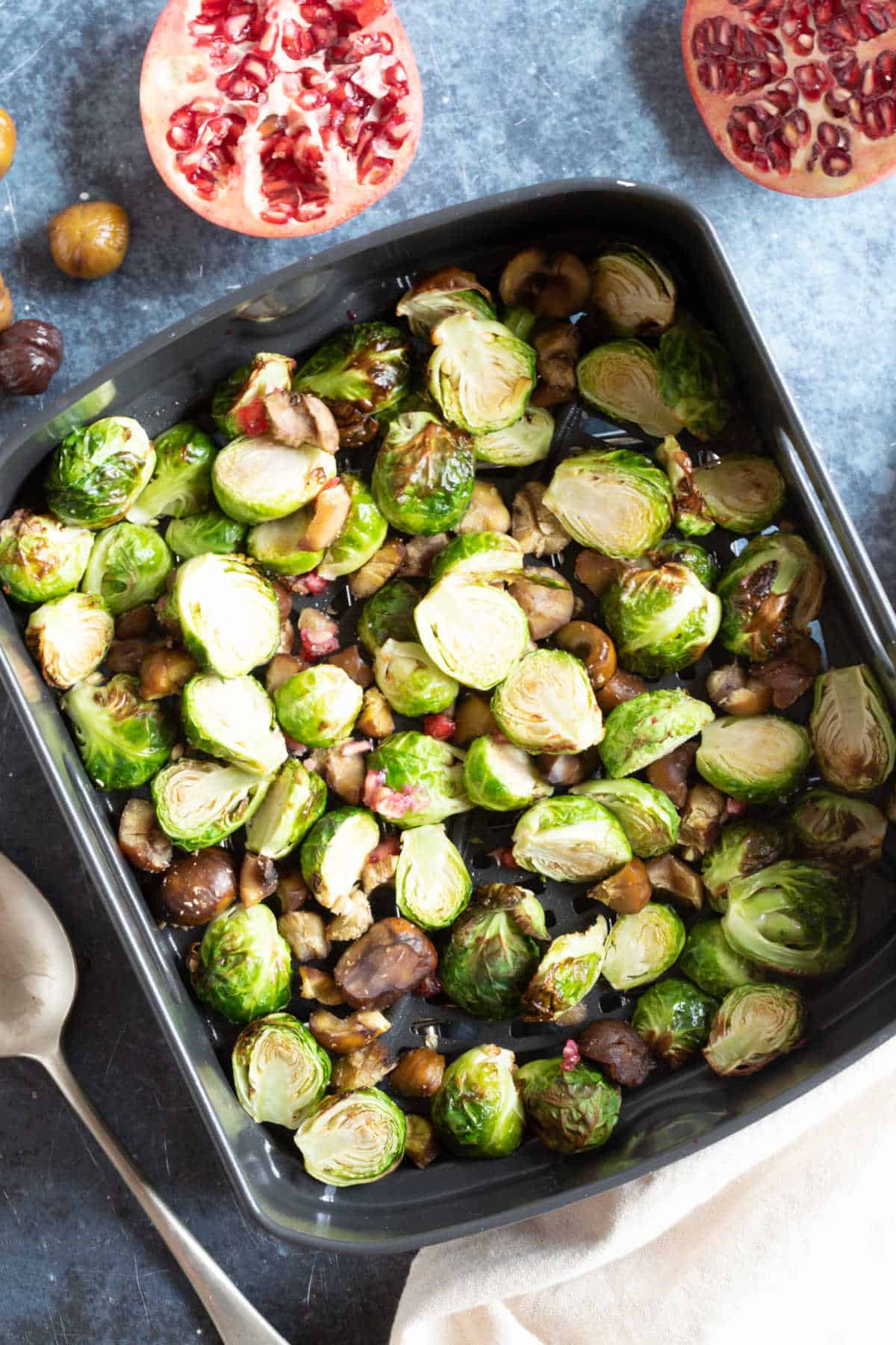 Brussels sprouts in the air fryer basket.