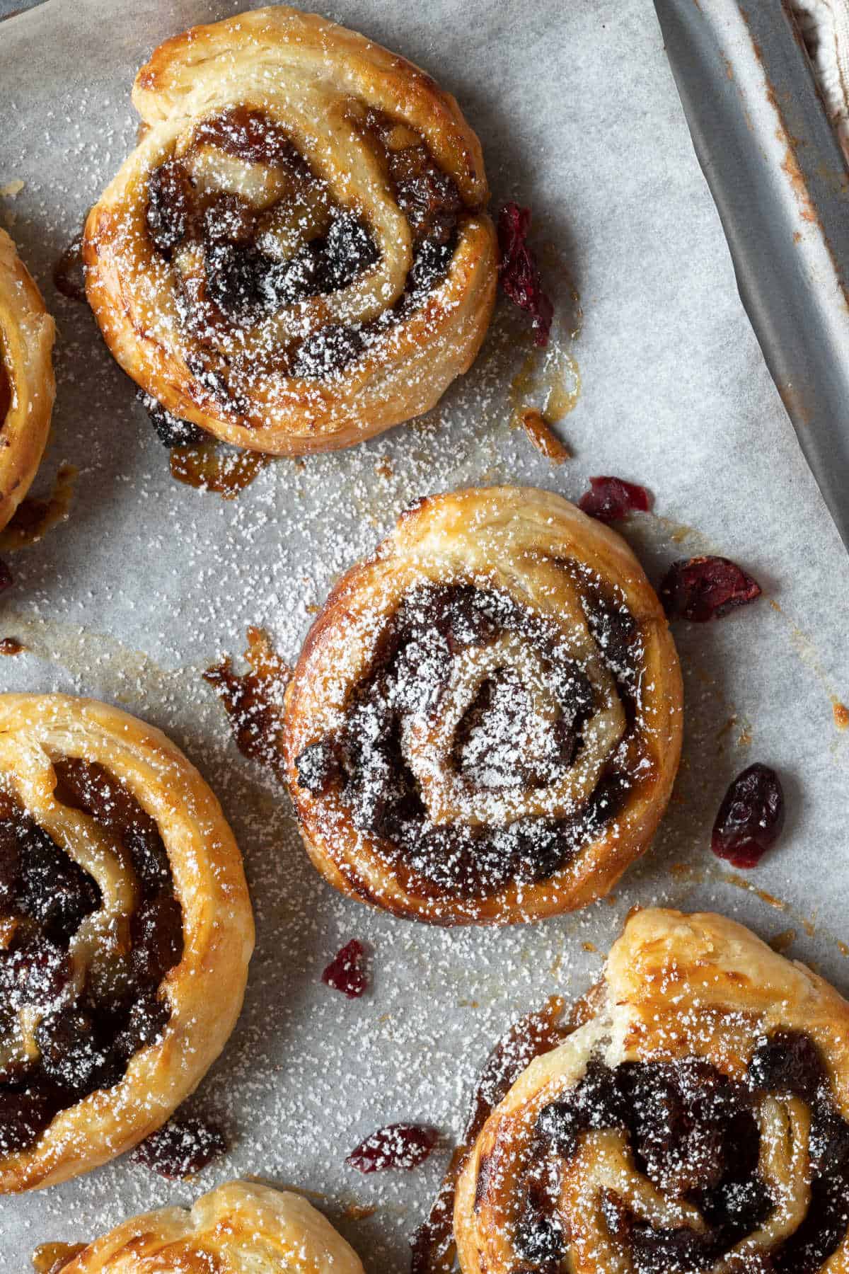 Mincemeat pinwheels on a baking sheet.