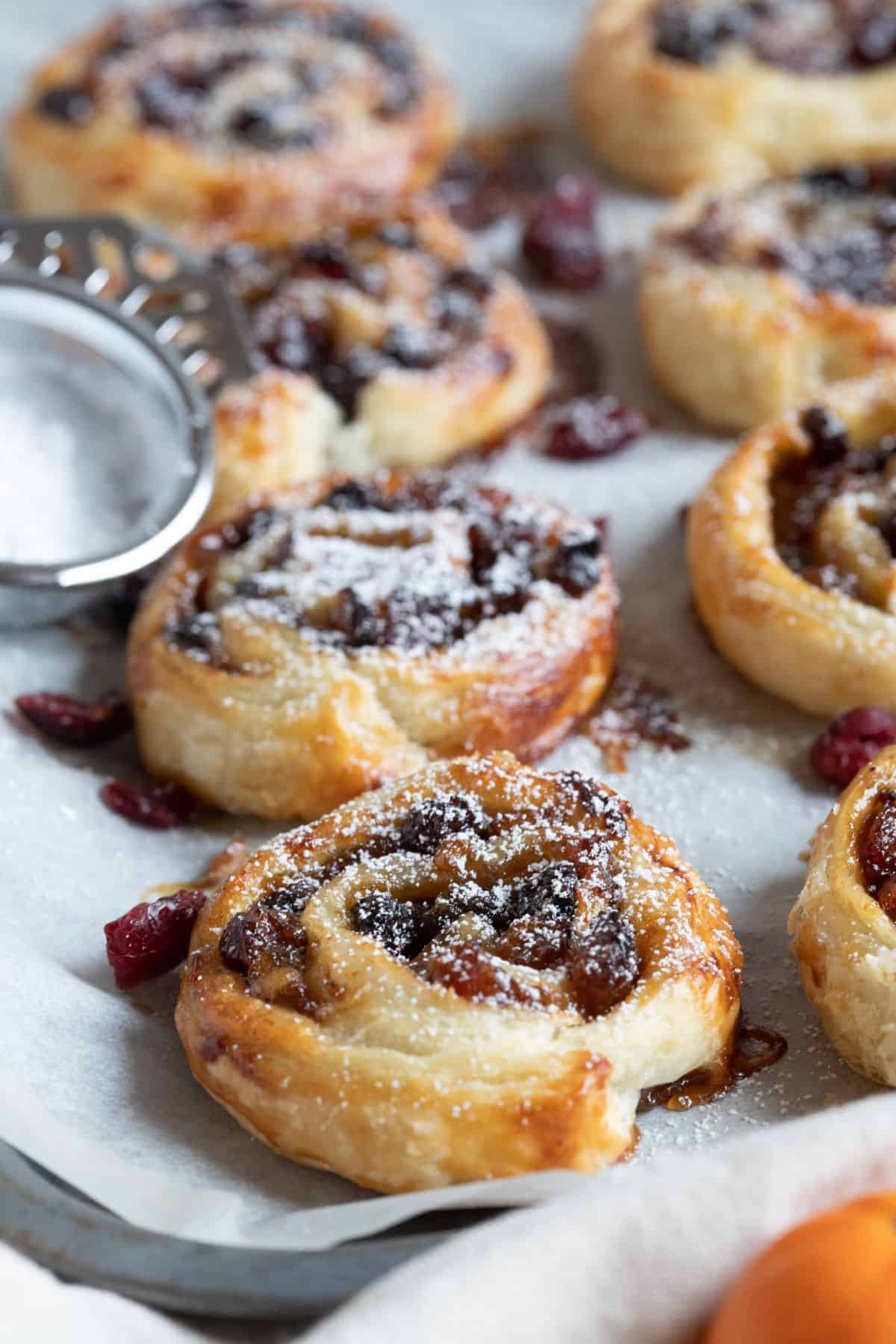 Mincemeat pinwheels on a baking tray.