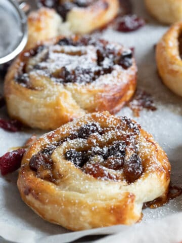 Mincemeat pinwheels dusted with icing sugar.