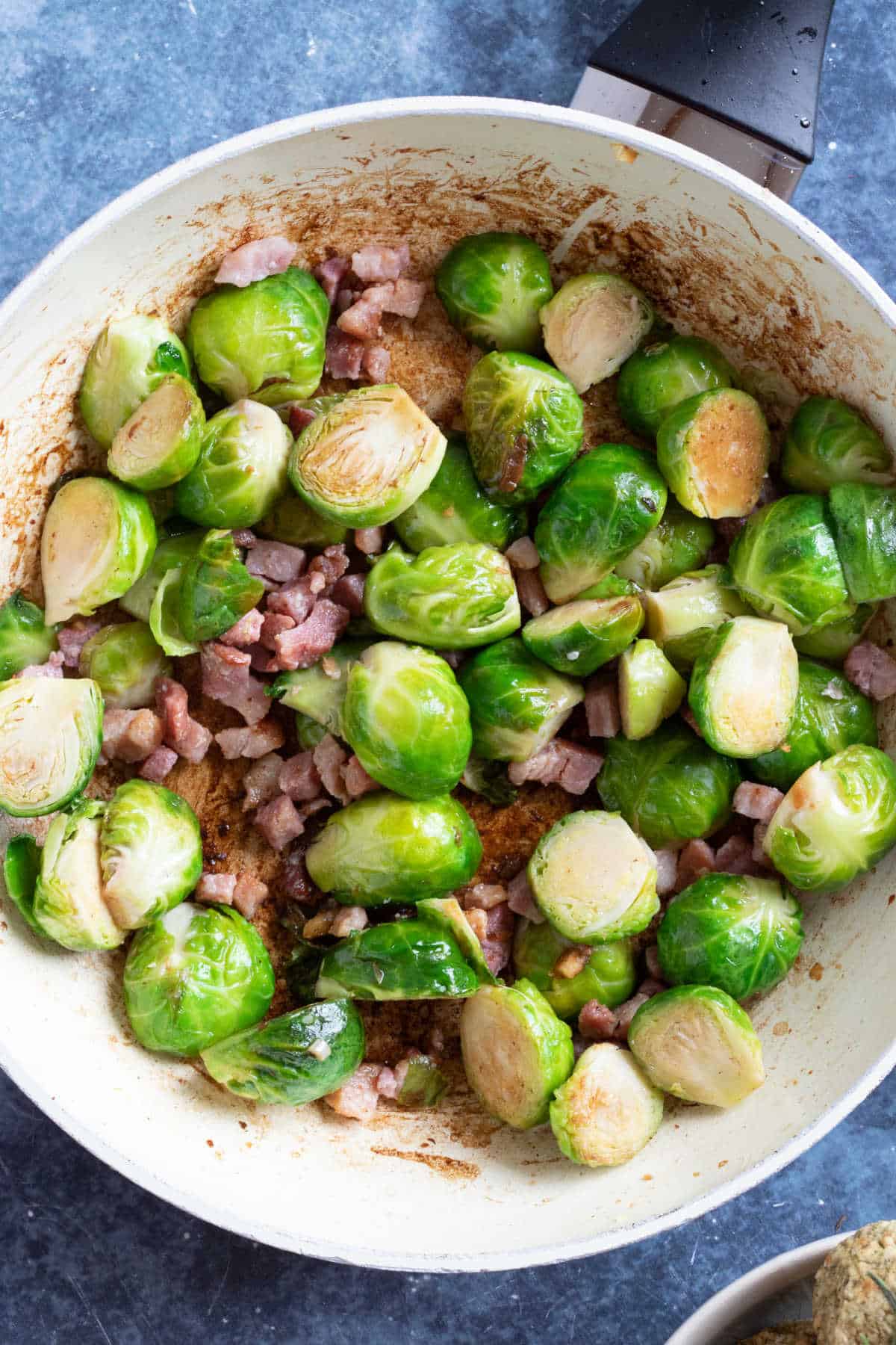 Pan fried brussels sprouts with crispy bacon.