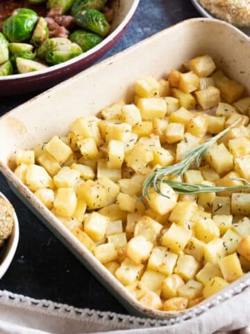 Parmentier potatoes in a roasting tin.