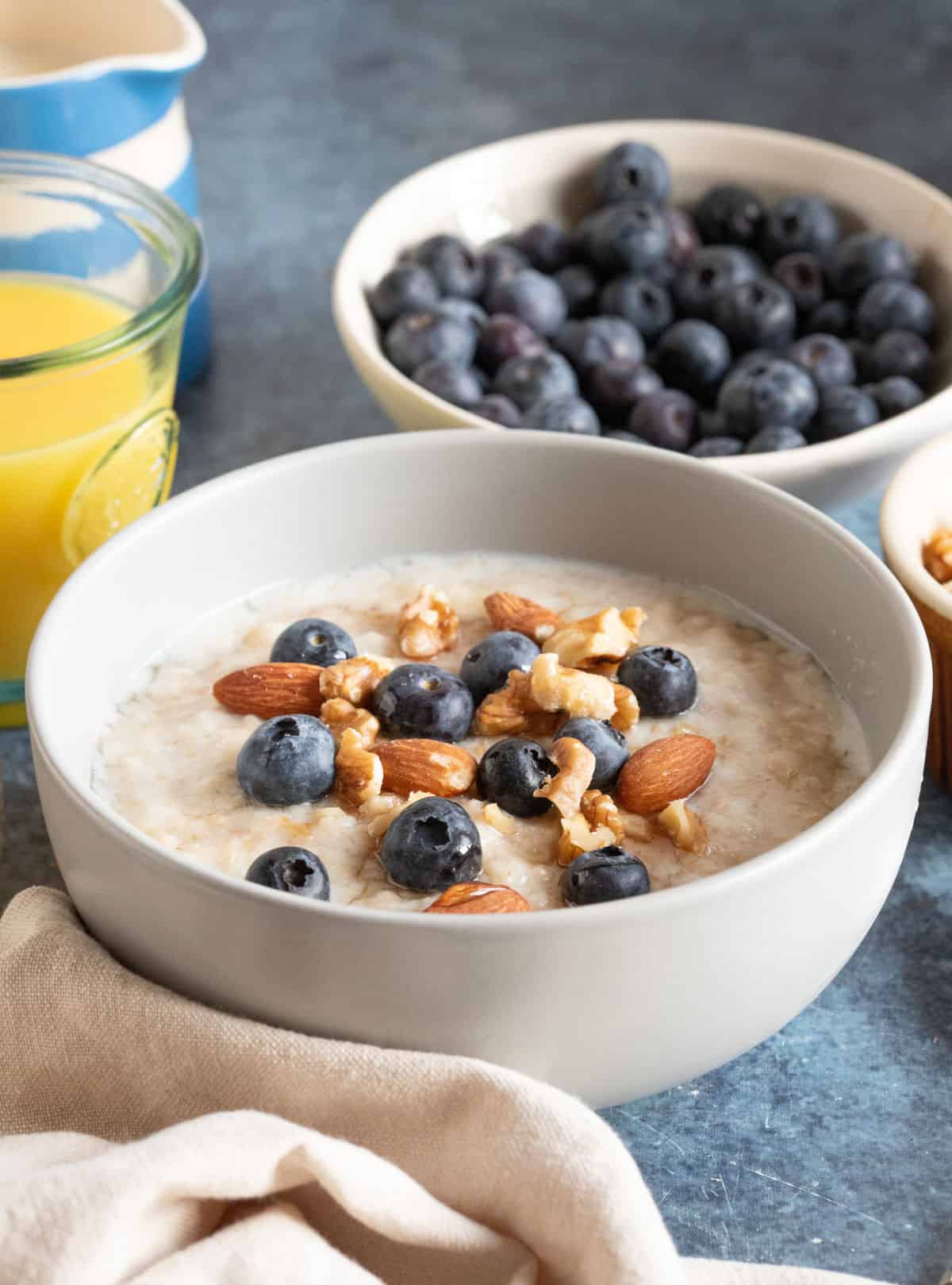 A bowl of slow cooker porridge with fruit and nuts.