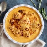 Cauliflower cheese in a baking dish.