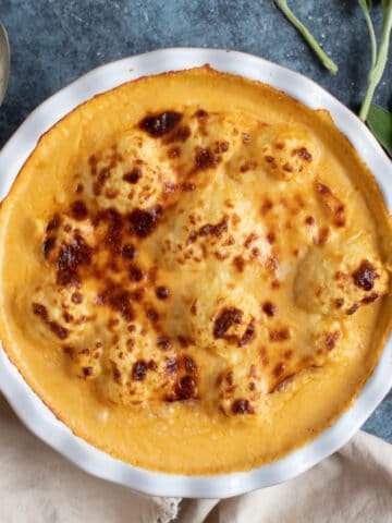 Cauliflower cheese in a baking dish.