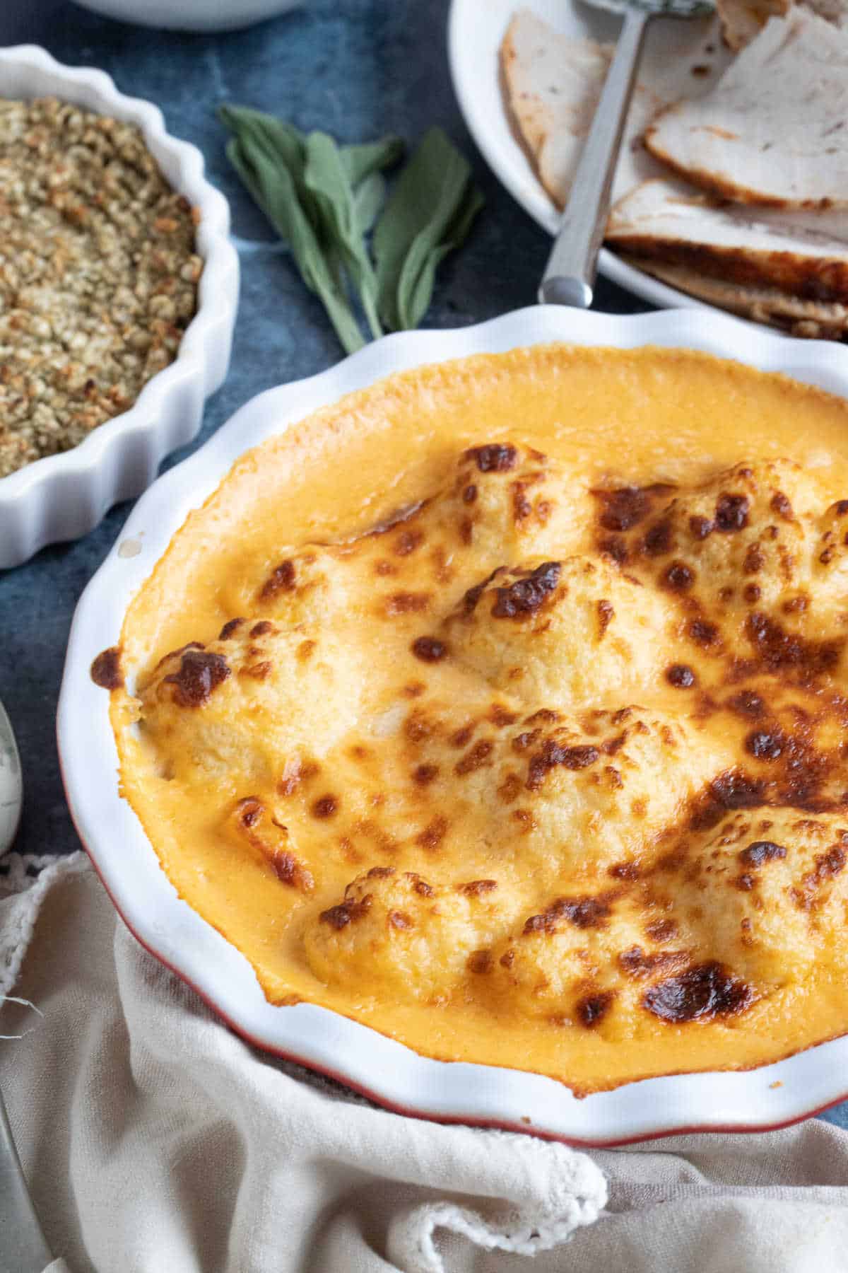 Cauliflower cheese in a baking dish.