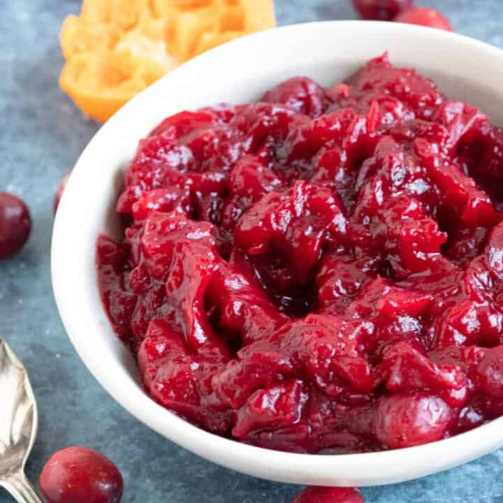 Homemade cranberry sauce in a white bowl.