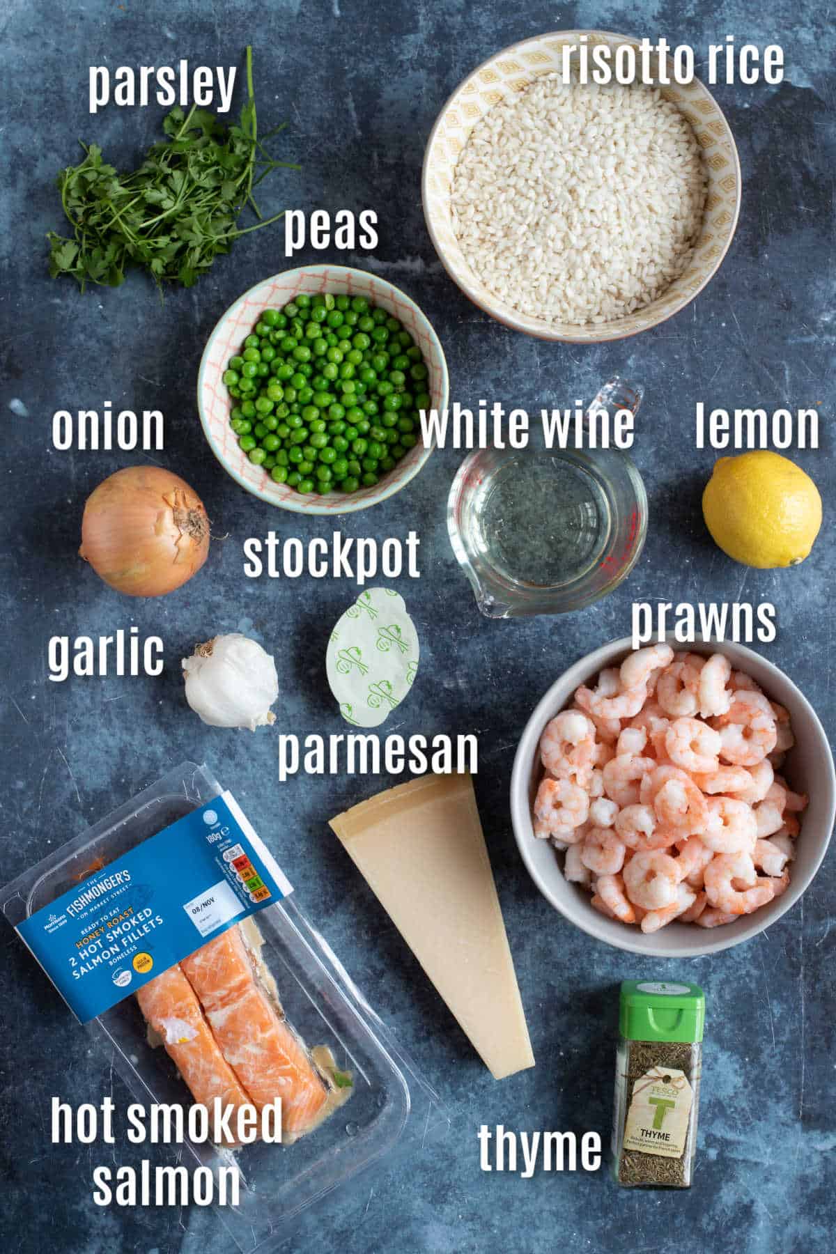 Ingredients needed to make salmon and prawn risotto.