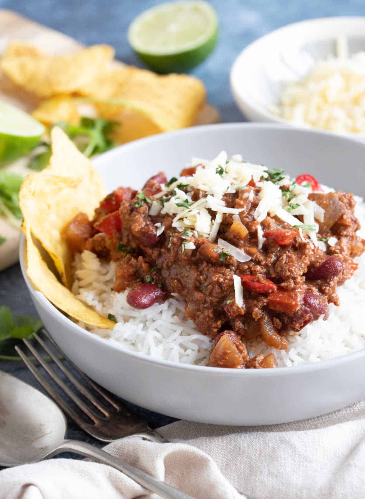 A bowl of slow cooker chilli con carne with chopped coriander.