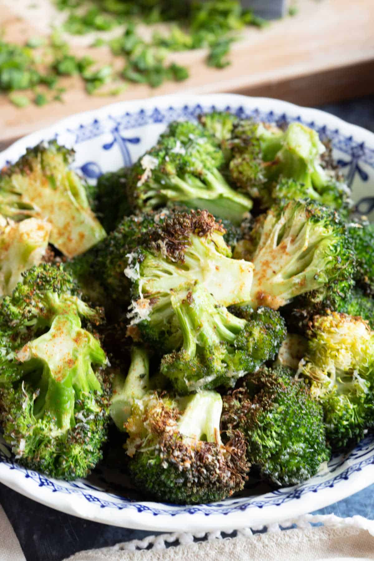 Air fryer broccoli in a bowl with Parmesan.