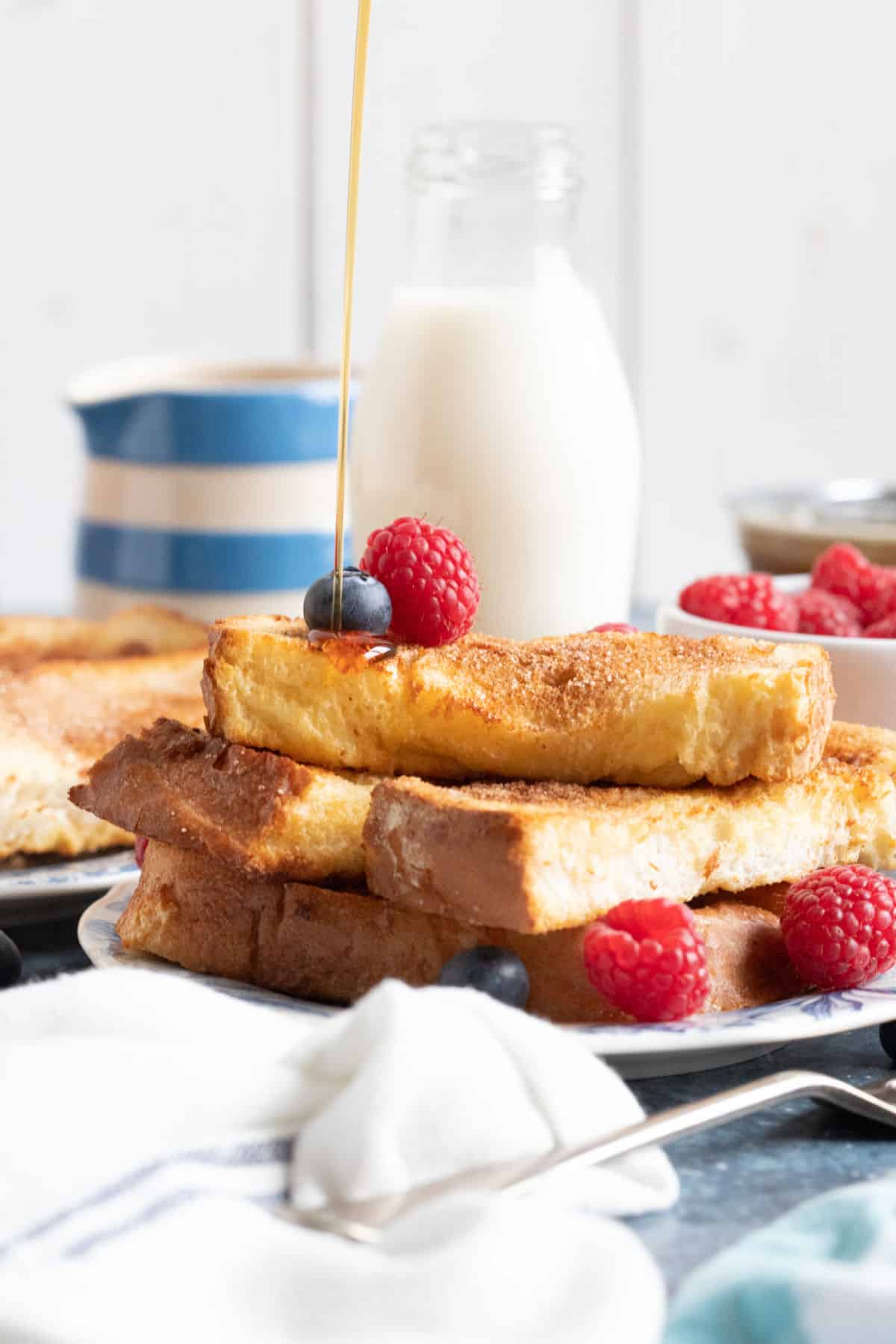 Maple syrup drizzled onto air fryer French toast.