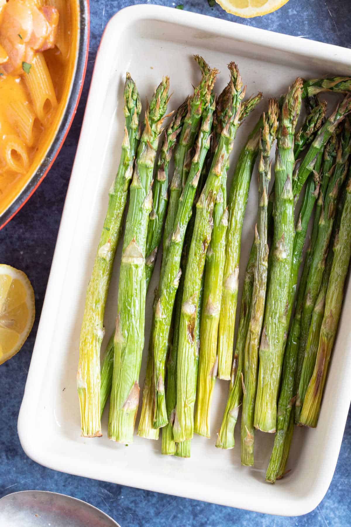 Air fryer roasted asparagus in a serving dish.