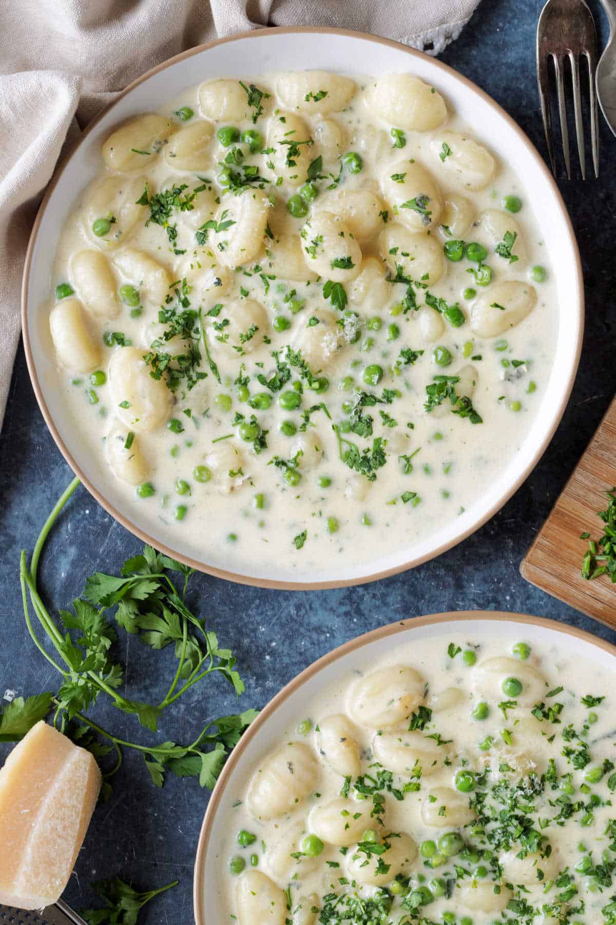 2 plates with creamy gnocchi.