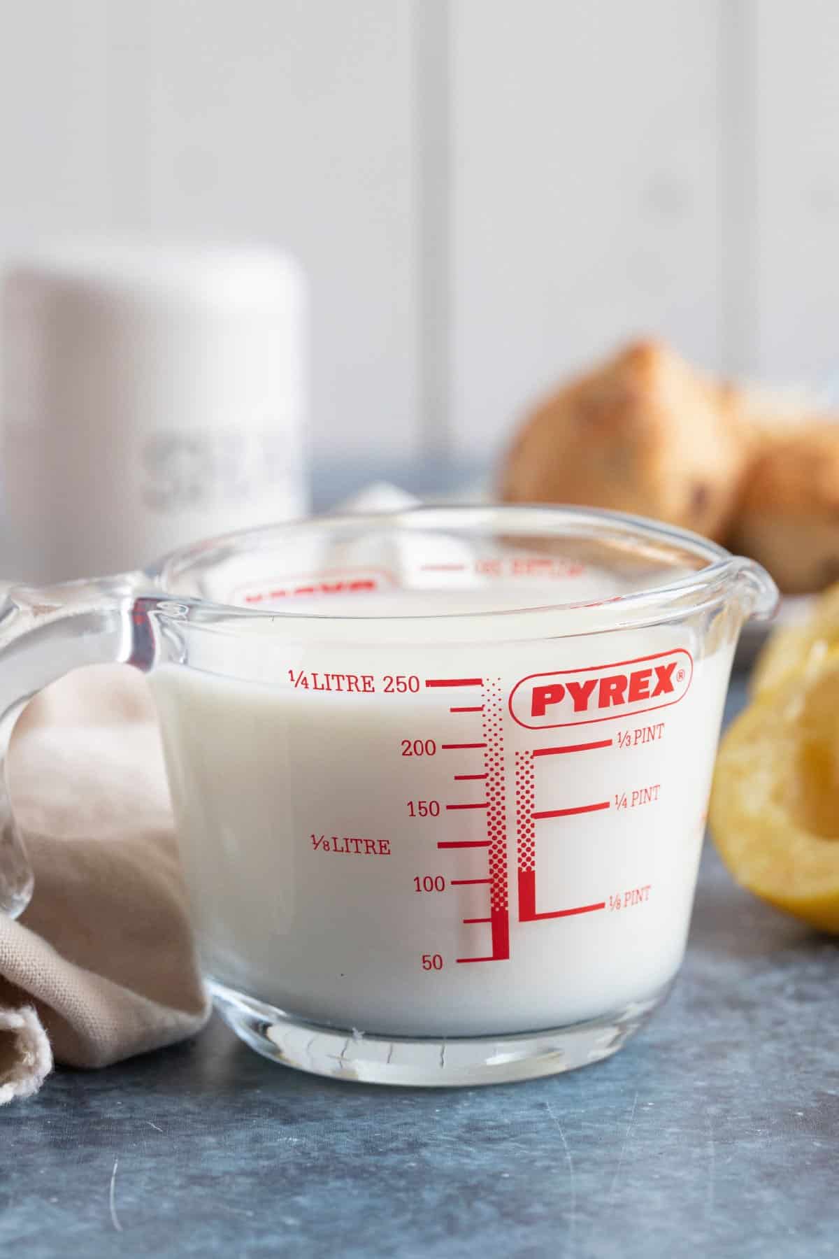 Homemade buttermilk in a glass jug.