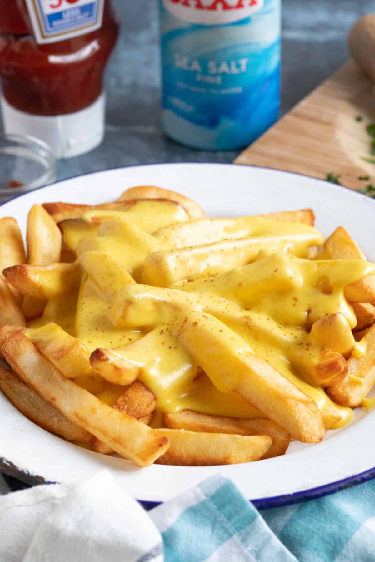 Cheesy chips with salt and ketchup.
