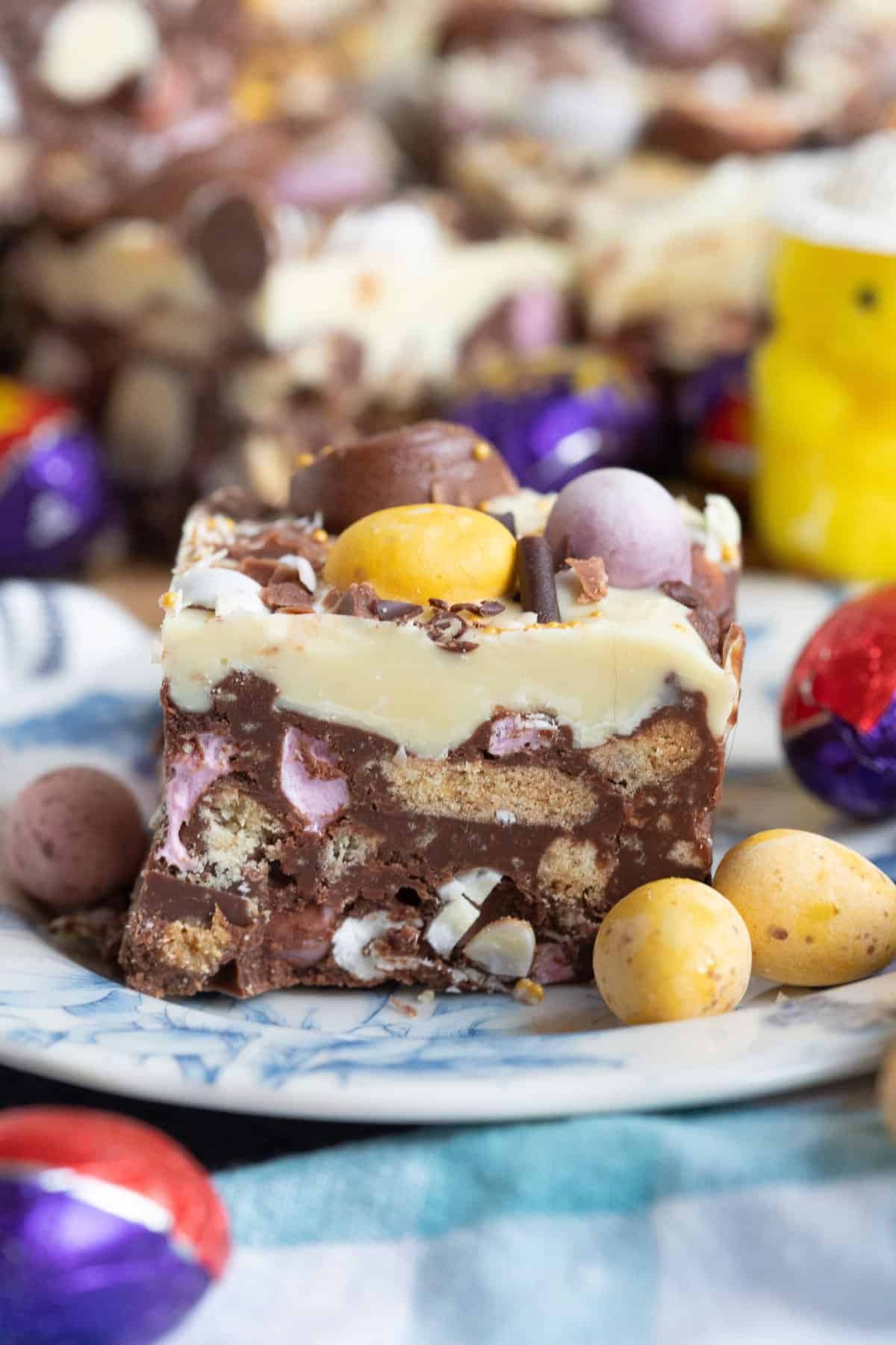 A slice of Easter Rocky Road on a blue and white plate.