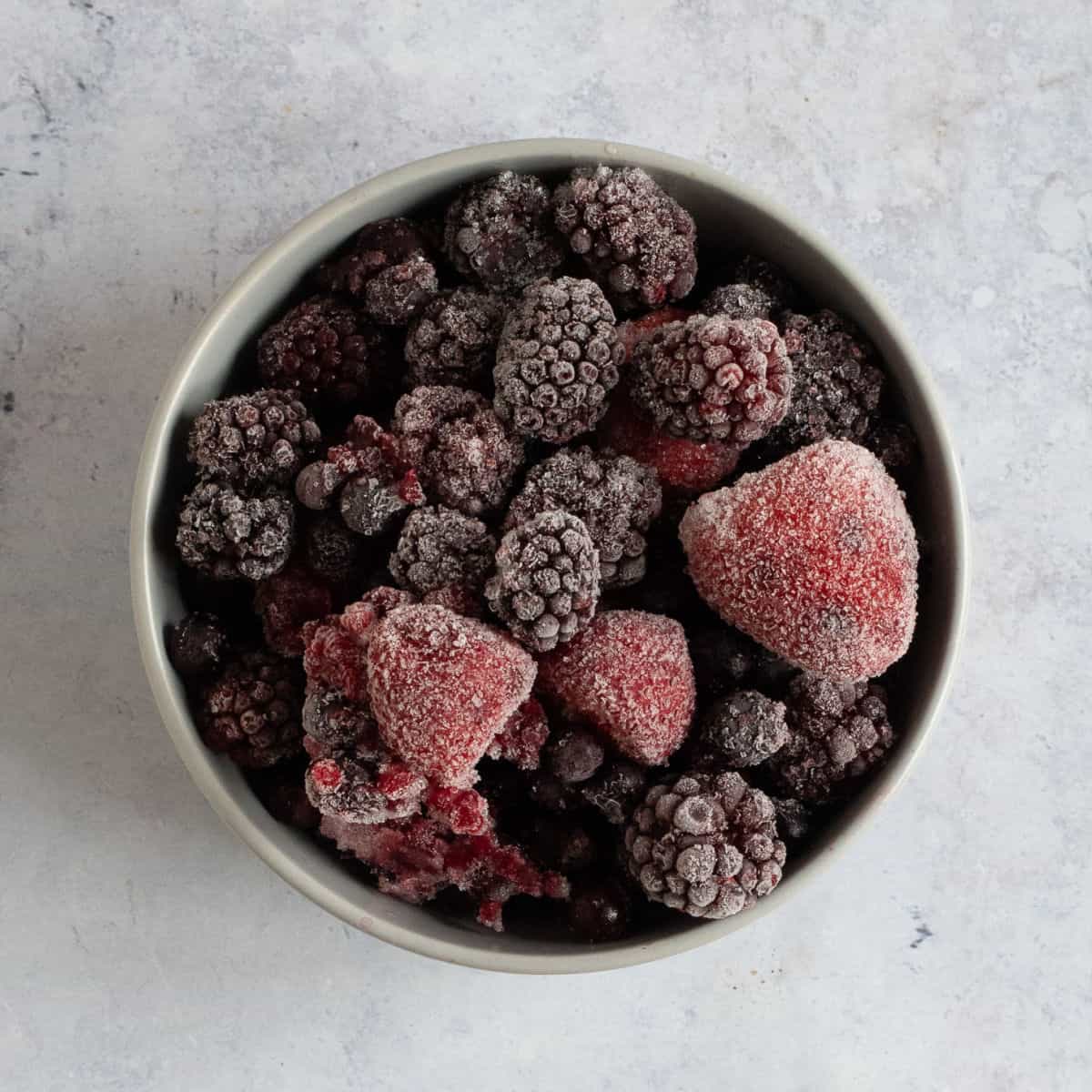 Frozen mixed berries in a bowl.