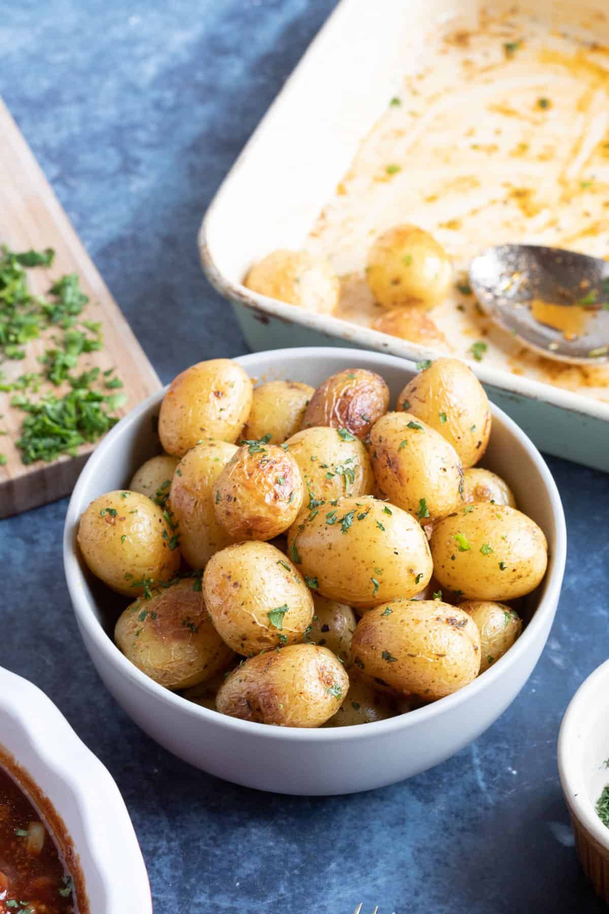 A bowl of roasted baby potatoes.