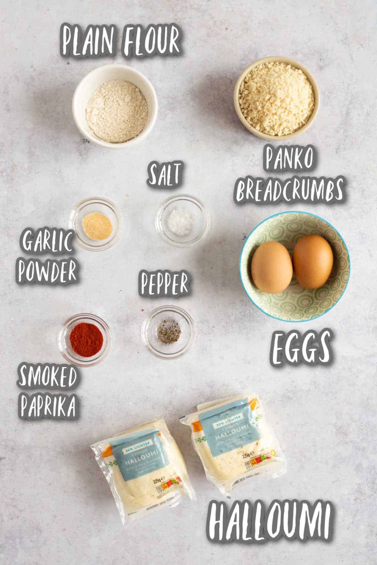 Ingredients for crispy baked halloumi fries with breadcrumbs.