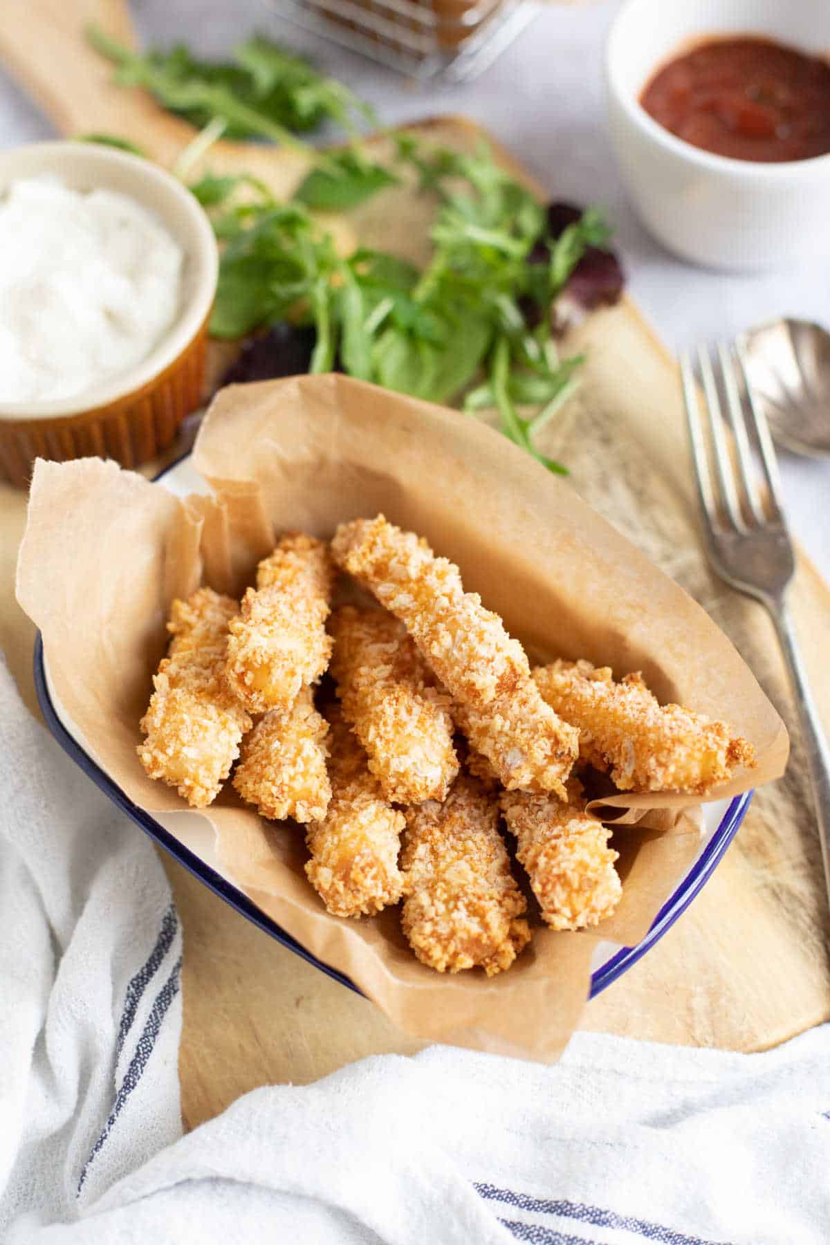 Halloumi fries in a baking dish.