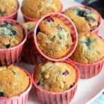 Blackcurrant muffins on a cake stand.