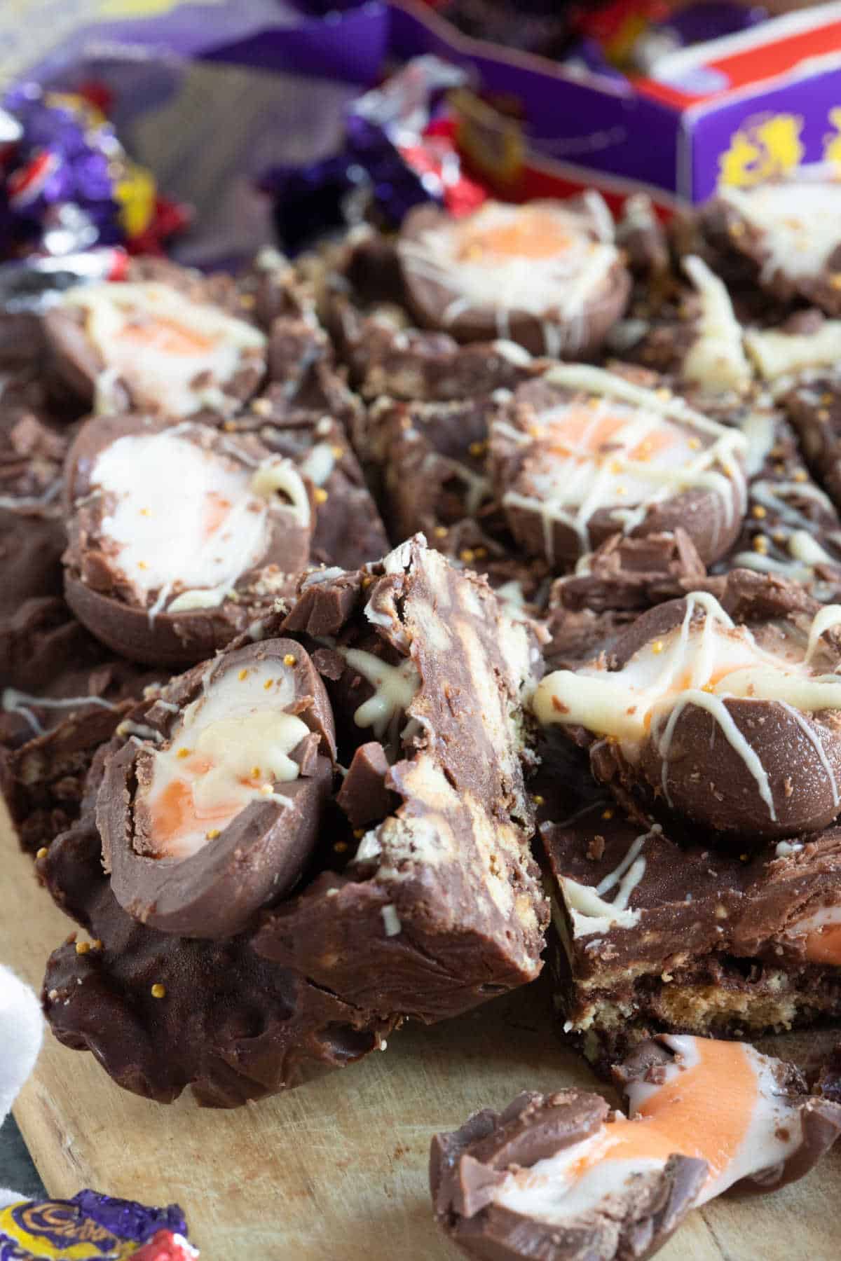 Creme egg tiffin on a cutting board.