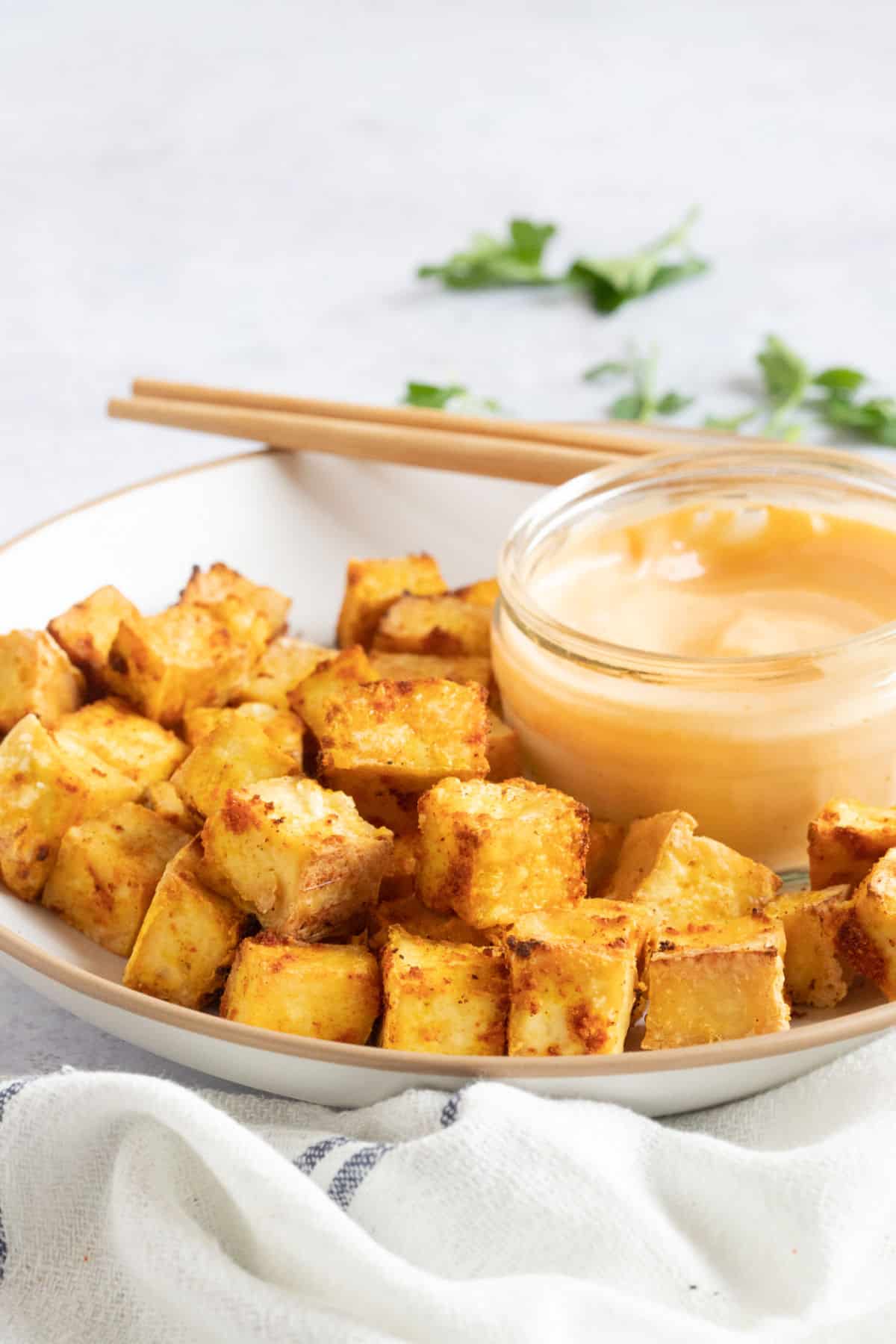 Crispy tofu bites on a plate.