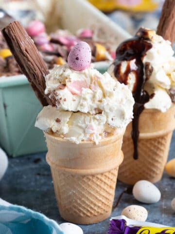 A cone of mini egg ice cream with a flake.