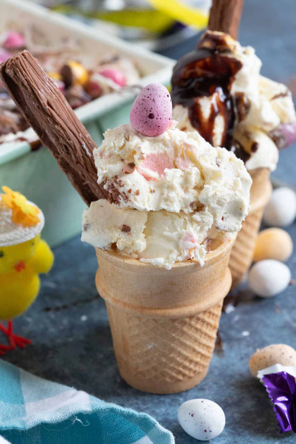 No churn mini egg ice cream in a cone with a flake.