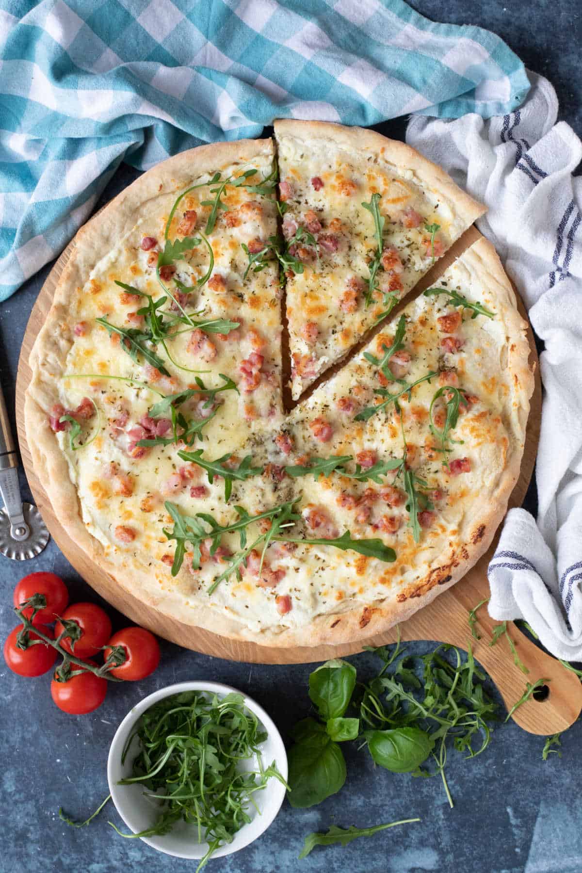 White pizza topped with wild rocket.