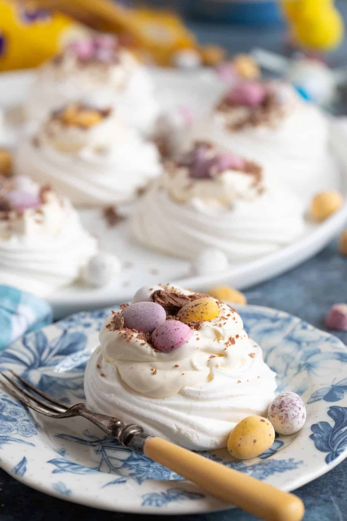 Mini Egg meringues on plates.