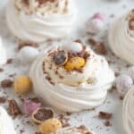 Easter meringue nests on a white platter.